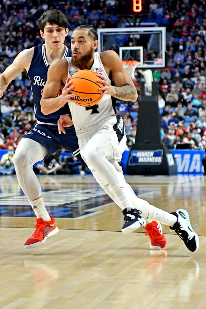 Mar 19, 2022; Buffalo, NY, USA; Providence Friars guard Jared Bynum (4) drives to the basket against Richmond Spiders guard Andre Gustavson (22) during the second half during the second round of the 2022 NCAA Tournament at KeyBank Center. Mandatory Credit: Mark Konezny-USA TODAY Sports